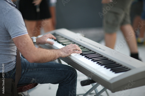 The man playing the electric piano concert at an outdoor festival in a small Sicilian town