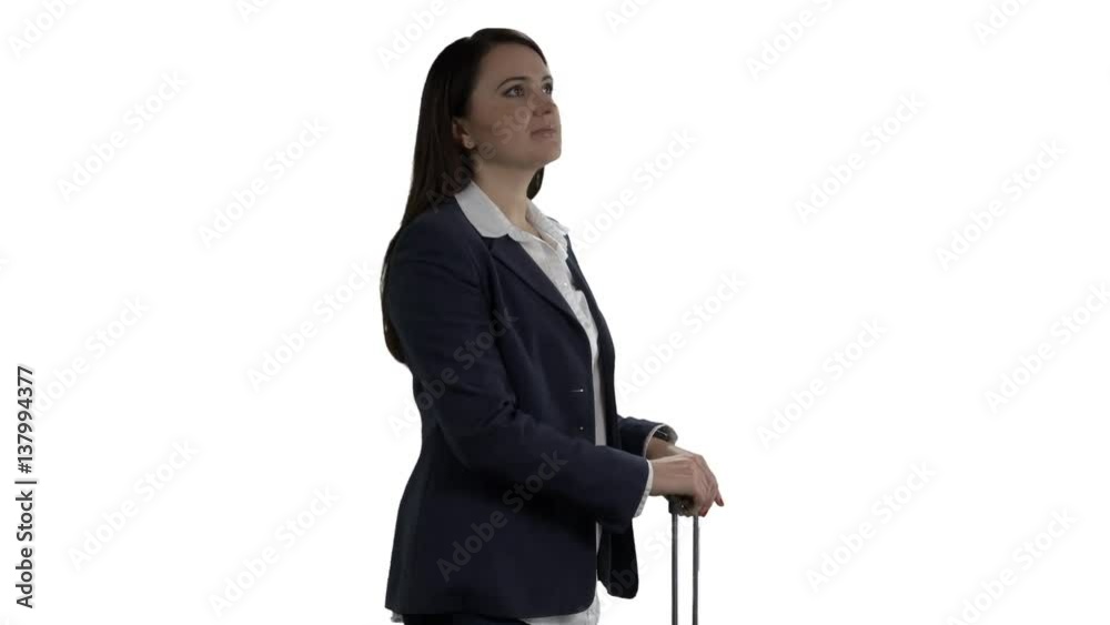 Woman with suitcase looking at watch and checking schedule on departure board against white background. 4k footage PNG with alpha channel. Woman with suitcase looking at watch and checking schedule on departure board against white background. 4k footage PNG with alpha channel.
