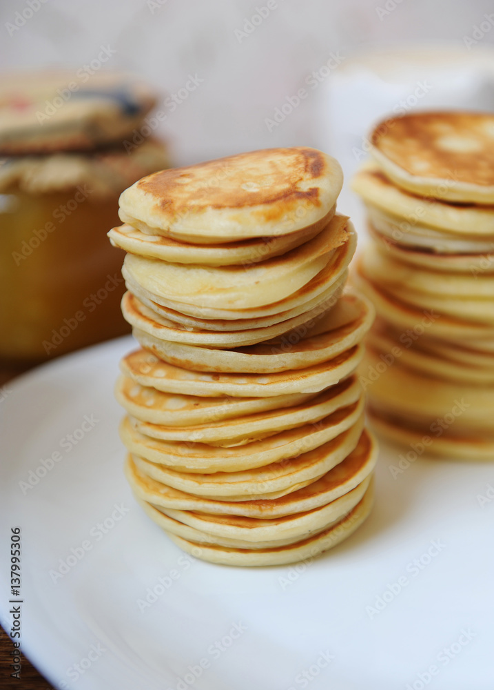 Pancakes on a white plate closeup Pancakes on a white plate closeup