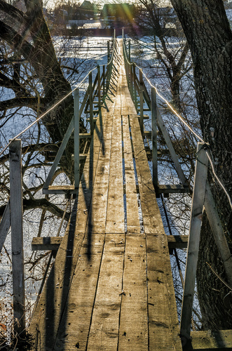 Fototapeta Naklejka Na Ścianę i Meble -  Hanging bridge in countryside. Protva river, Russia