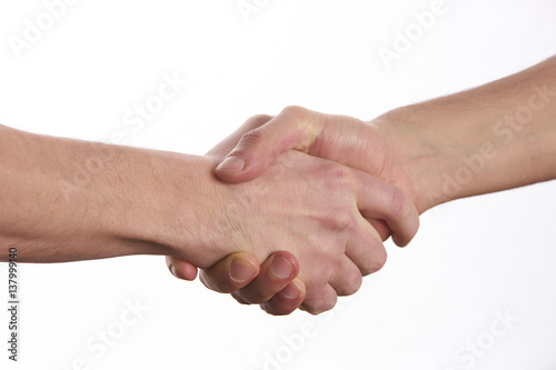 Closeup image of a Business handshake. Business handshake and business people concept. Two men shaking hands over isolated white background. Partnership, Deal.