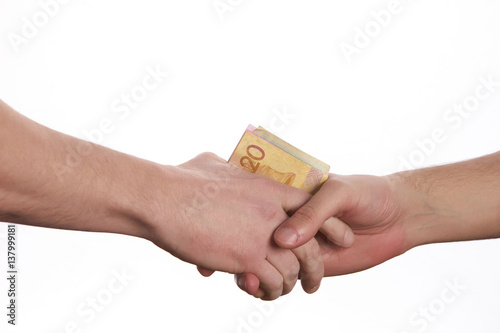 Giving a bribe. Money in hand.Concept - corruption.Isolated on White background.