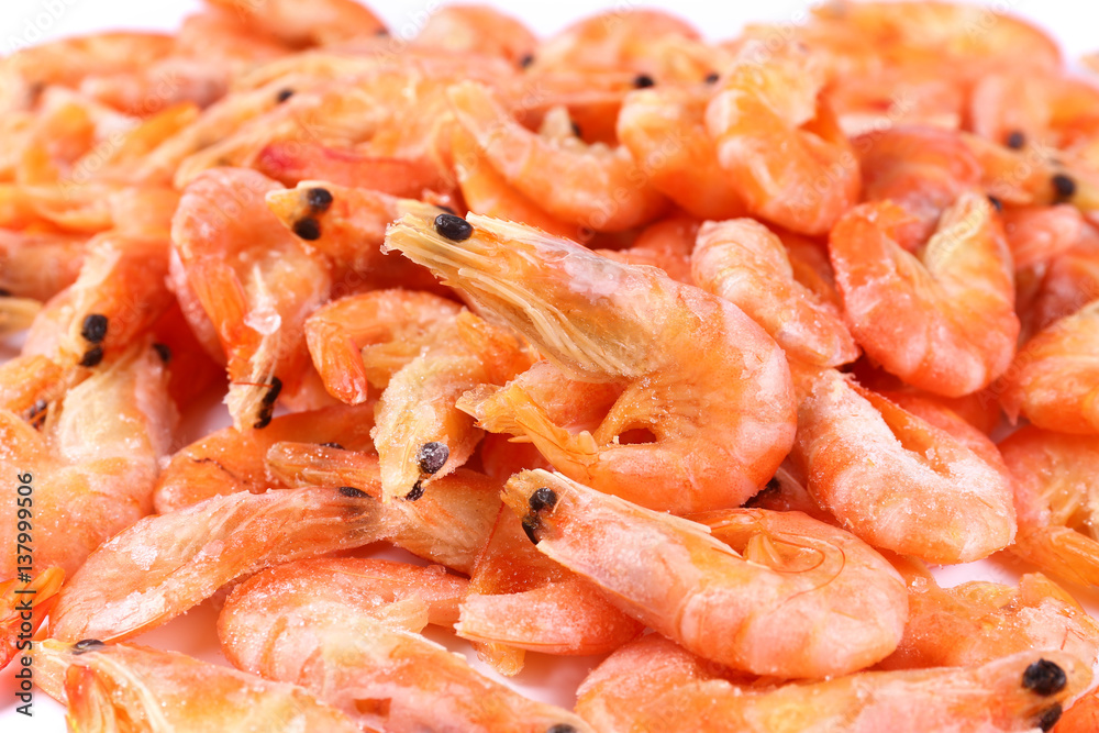 Frozen fresh shrimp on white background (isolated). Snack to beer. Close up Frozen fresh shrimp on white background (isolated). Snack to beer. Close up