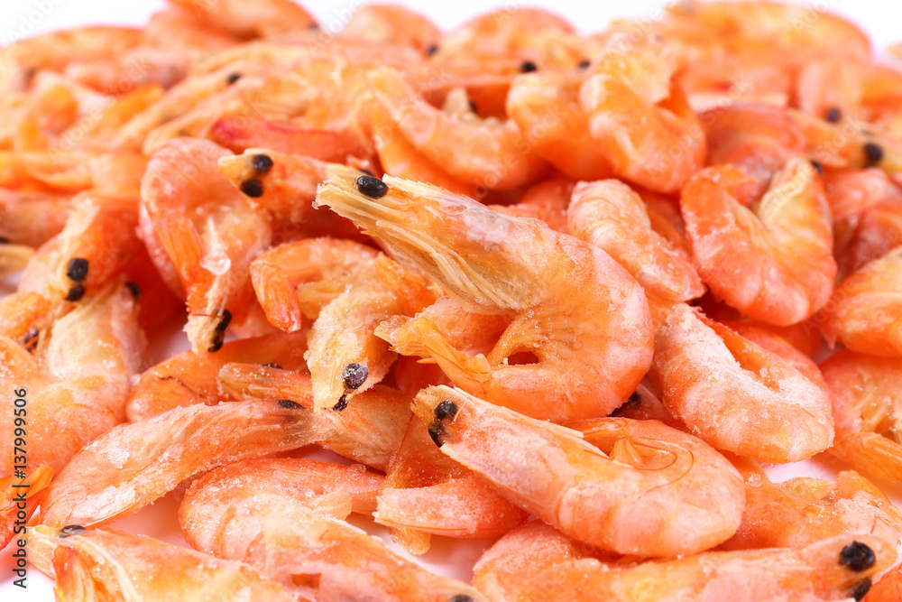 Frozen fresh shrimp on white background (isolated). Snack to beer. Close up