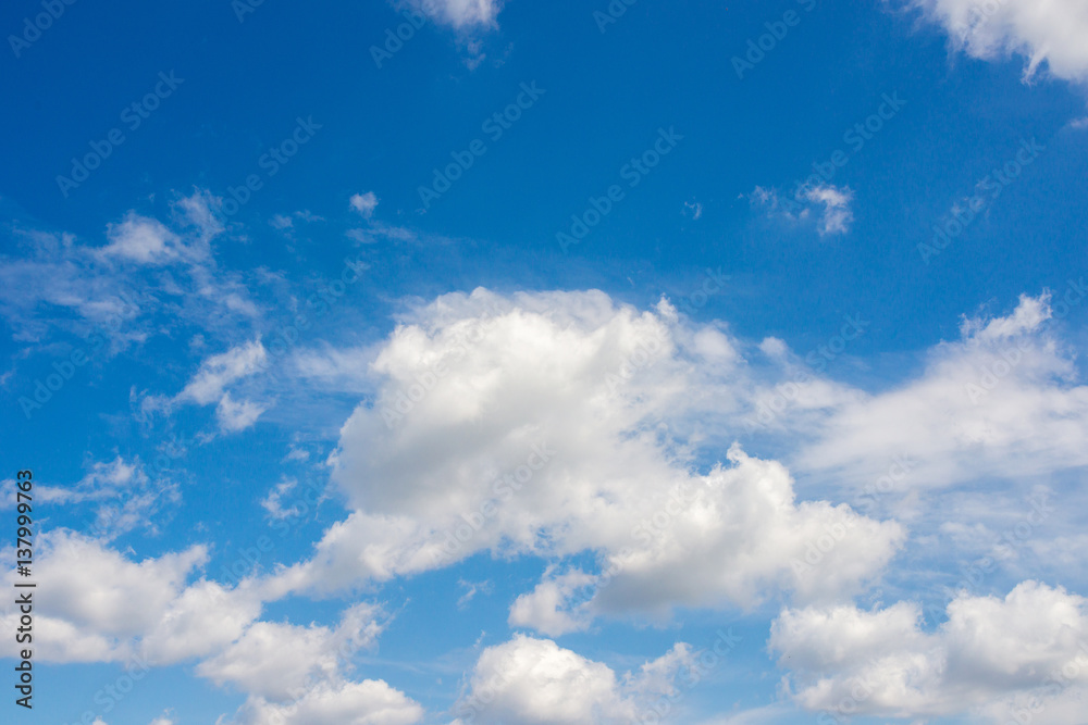 White fluffy clouds in the blue sky