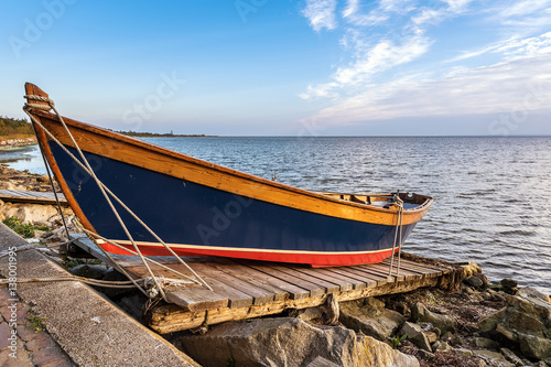 Wooden colorful boat left on the shore. Baltic Sea  Poland.