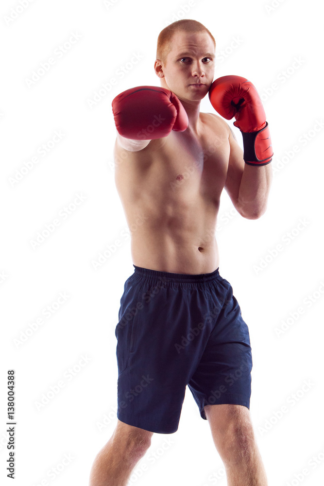 Full length portrait of young male boxer flexing muscles isolated over white background Full length portrait of young male boxer flexing muscles isolated over white background