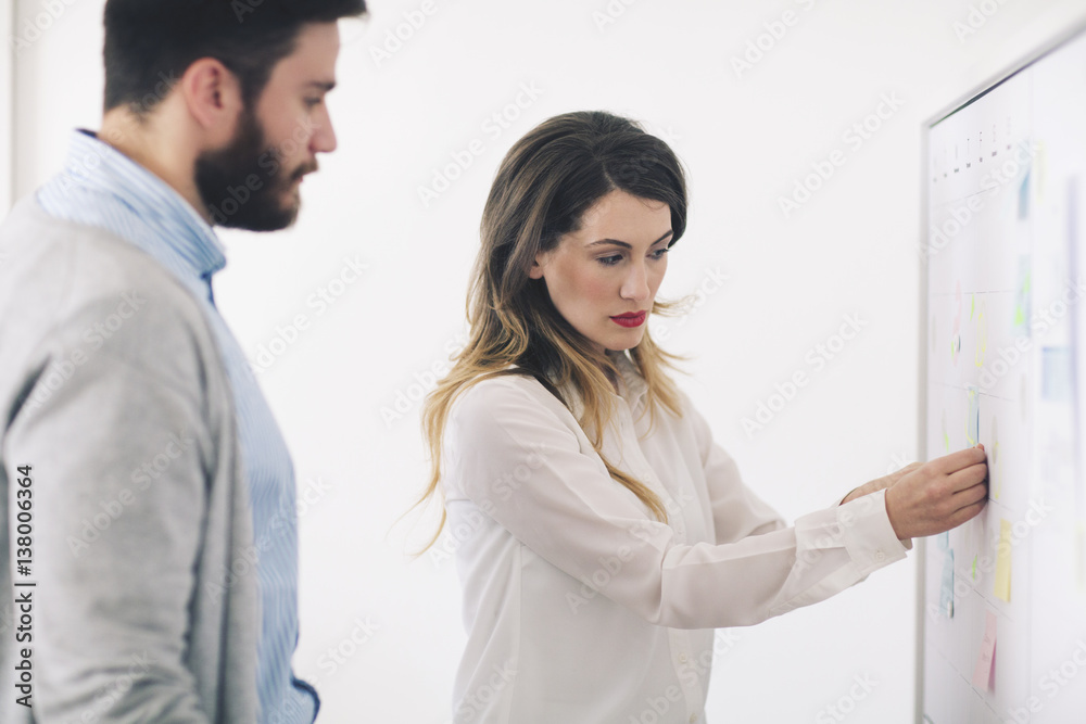 Businesswoman explaining coworker in office Businesswoman explaining coworker in office