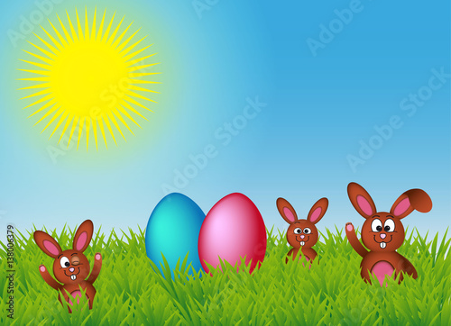 Simpatici coniglietti nell'erba che salutano con le uova di Pasqua