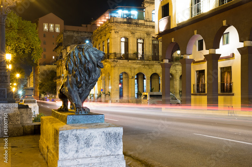 Photography Night scene in Old Havana with a famous bronze lion considered a symbol of the c
