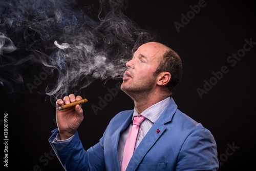 businesman smooking cigar