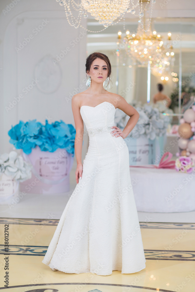 Fototapeta premium young beautiful bride with make-up and styling