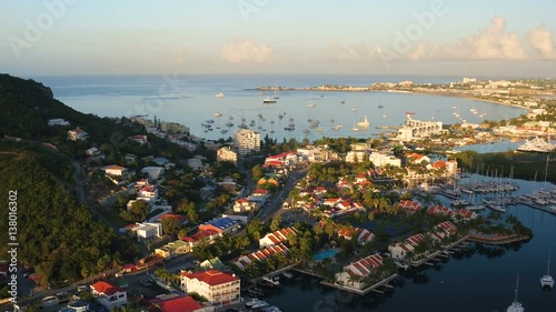 St Maartin Aerial v34 Flying low over Simpson Bay Lagoon panning at sunrise.