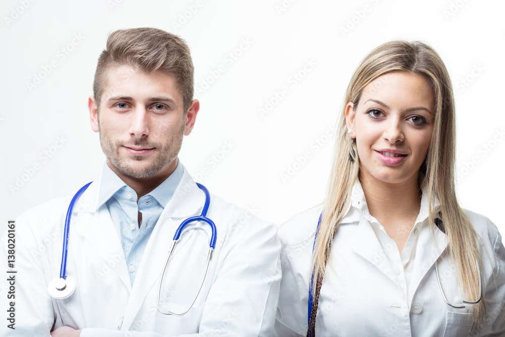 Doctors with stethoscope around their neck smiling at the camera Doctors with stethoscope around their neck smiling at the camera