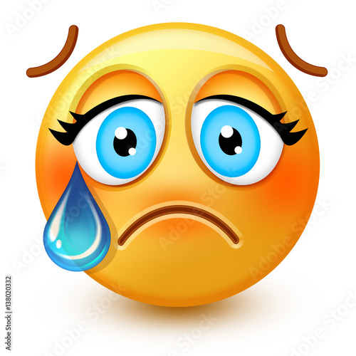 Cute crying-face emoticon or 3d sad emoji with a single tear running from one eye, down the cheek. photo
