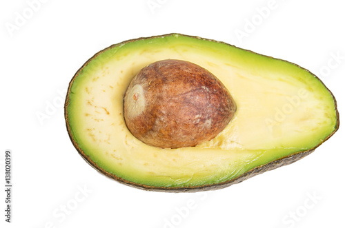 Fresh avocado cut in half with bone isolated on white background