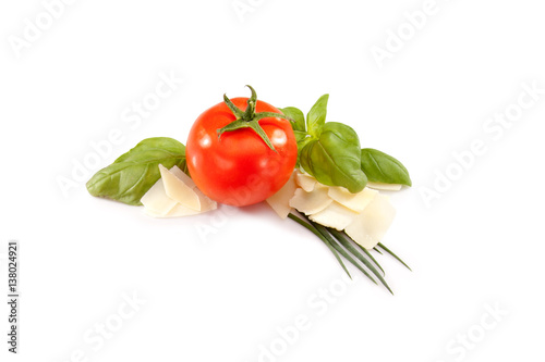 Tomato, basil, cheese and green onions on white