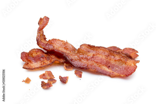  Strips of bacon and bits on white  photo