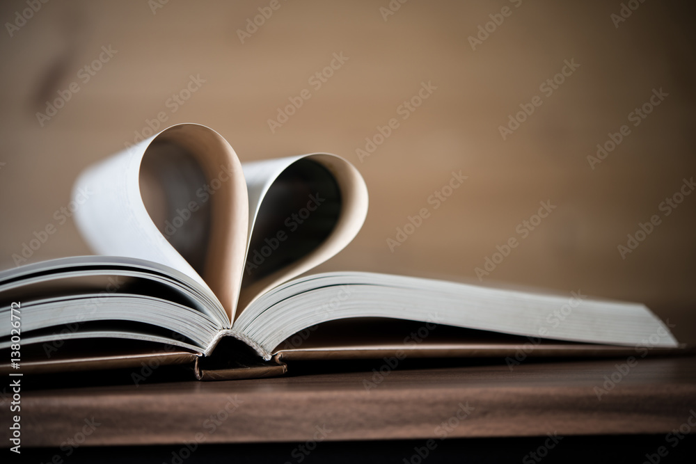 Pages of a book forming the shape of the heart. Love concept. Pages of a book forming the shape of the heart. Love concept.