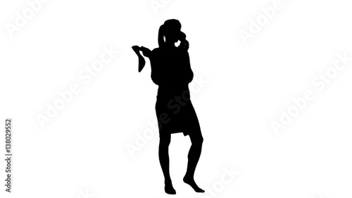 Silhouette Young chatty woman using a shoe like a telephone 