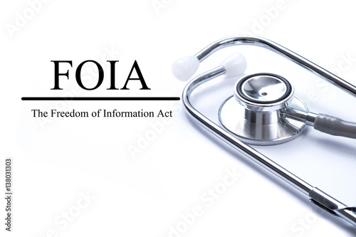 Page with FOIA (The Freedom of Information Act) on the table with stethoscope, medical concept. photo