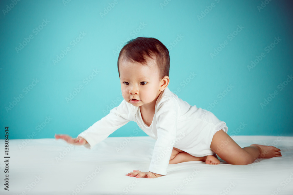 Side view of pretty crawling newborn (soft focus on the eyes) Side view of pretty crawling newborn (soft focus on the eyes)