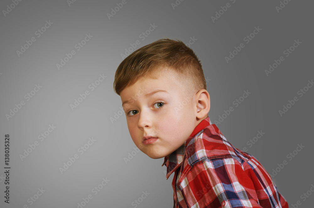 portrait of a beautiful boy . Stylish boy posing . the concept of children's fashion portrait of a beautiful boy . Stylish boy posing . the concept of children's fashion