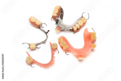 old man real denture with plastic type and stainless steal type. photo