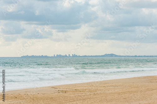 Surfers Paradise beach with distant cityscape on the horizon