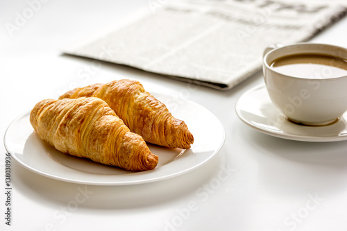 Business lunch with croissant on white table top view