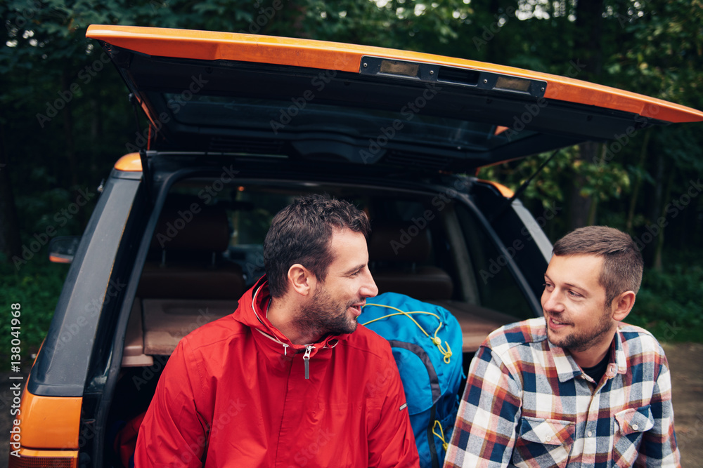 Hikers talking together before going wilderness trekking Hikers talking together before going wilderness trekking