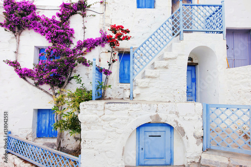 Fototapeta Naklejka Na Ścianę i Meble -  Traditional greek house with flowers in Astypalaia island, Dodecanese, Greek islands