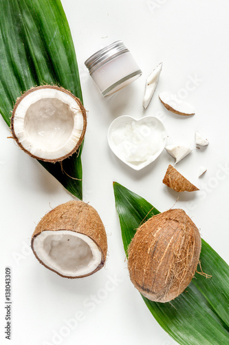 organic cosmetics with coconut on white background top view