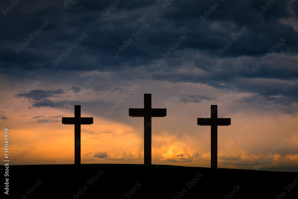 Jesus Christ cross between two crosses on Golgota Mountain, on blue,  orange, purple sky with dramatic clouds,light,sunset, twilight, dusk.  Easter, Crucifixion, resurrection, Good Friday concept Stock Photo | Adobe  Stock