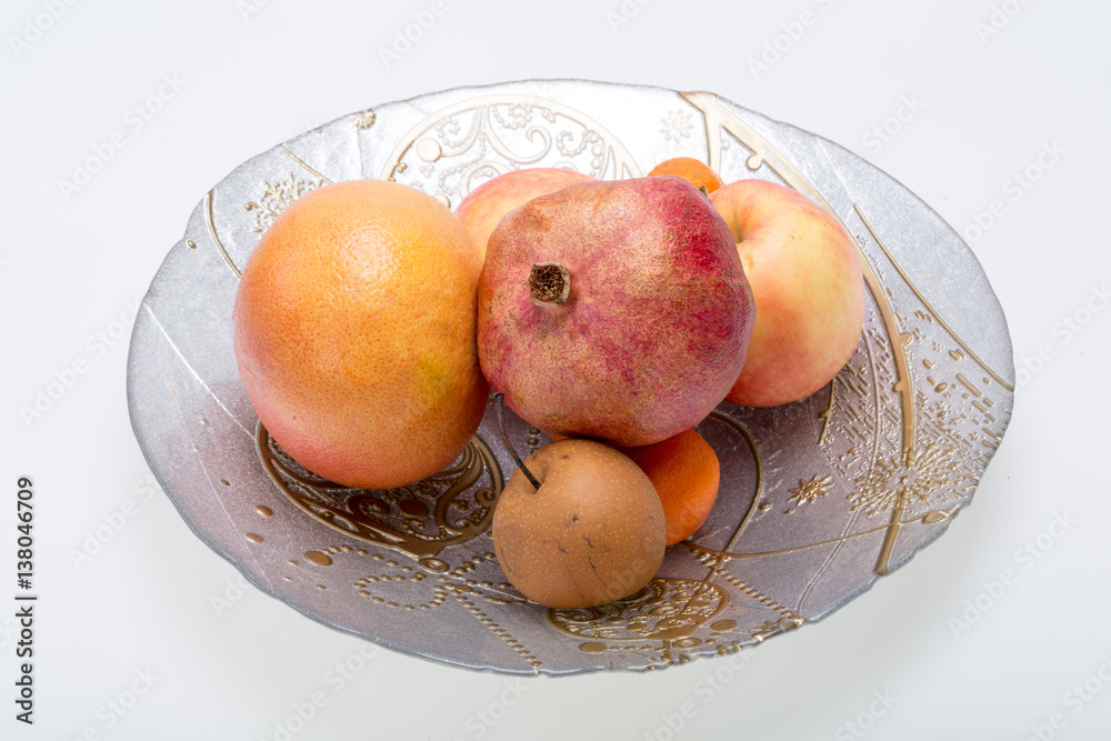 mix fresh fruits on plate isolated on white mix fresh fruits on plate isolated on white