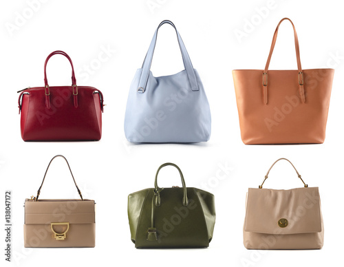 group of women leather color handbags isolated on white background