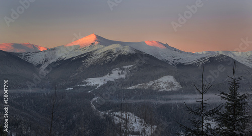 Illuminated mountains - winter scene