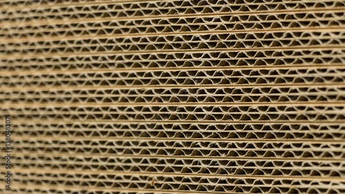 Extreme close up / macro slide of stacked cardboard boxes. Ideal for paper, packing or recycle  projects. 4K, 60fps