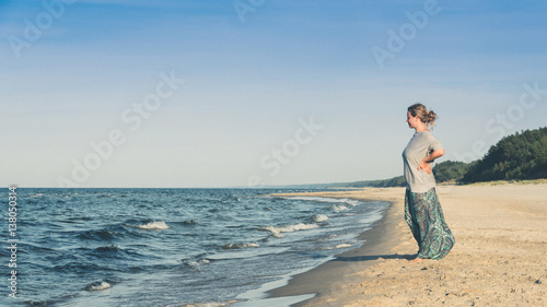 Woman standing on a beach