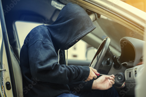 Photography side view of car thief in action