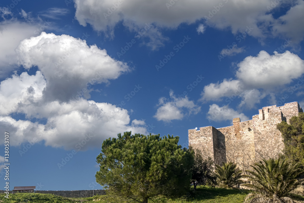 The Rocca Aldobrandesca of Talamone, Grosseto, Tuscany, Italy, against a dramatic and picturesque sky