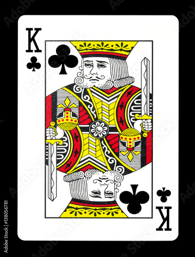 King of clubs playing card, isolated on black background.