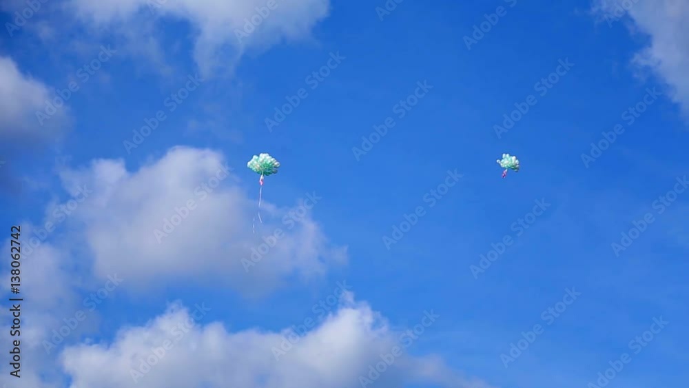 A lot of balloons flyes in blue sky at sunny day A lot of balloons flyes in blue sky at sunny day