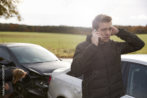 Man Calling To Report Car Accident On Country Road © Monkey Business