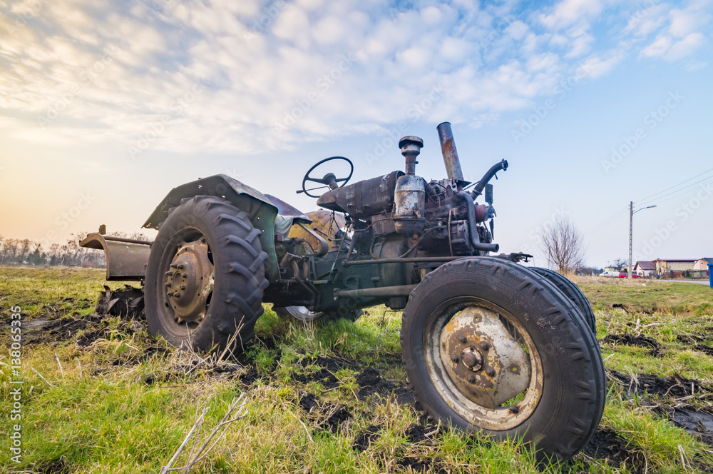 dilapidated tractor in the Polish countryside dilapidated tractor in the Polish countryside