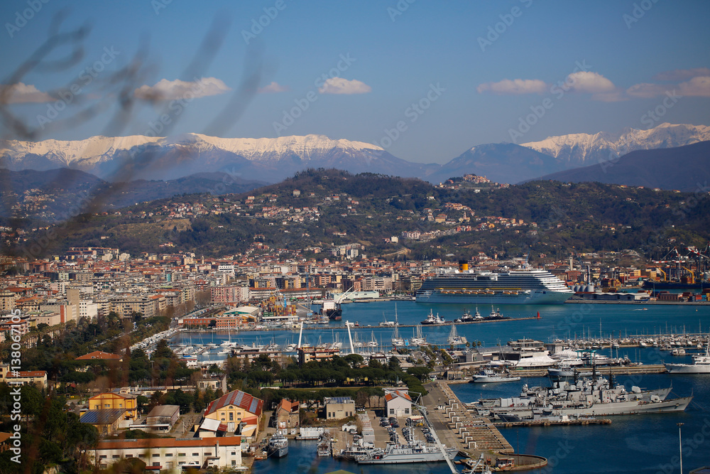 Panorama with a harbour, houses, sea and mountains