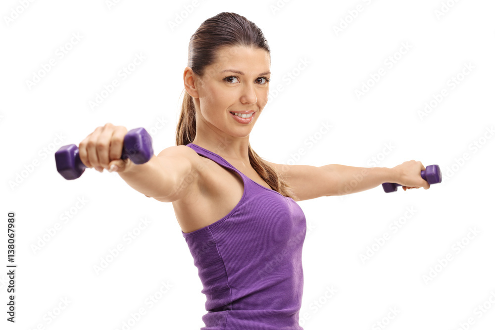 Young woman working out with dumbbells