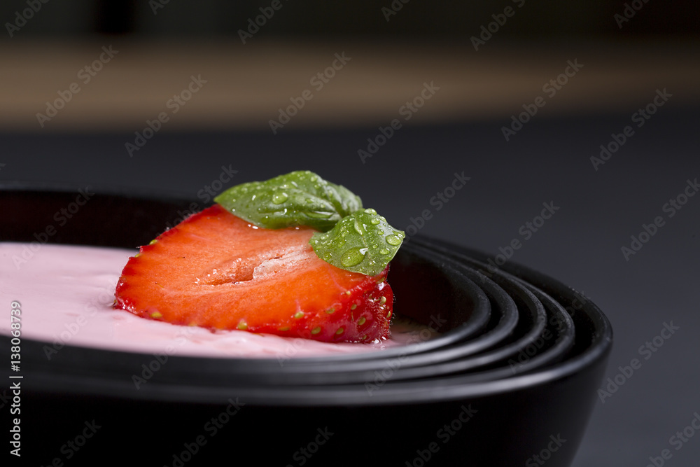 quark with strawberry in a black asian bowl