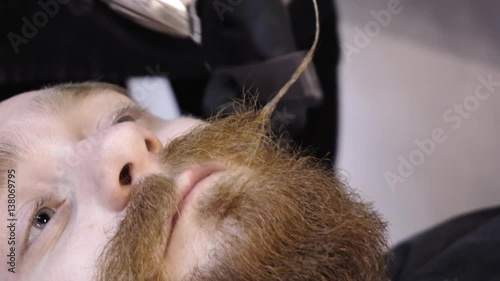 Men's hairstyling and haircutting in a barber shop or hair salon.