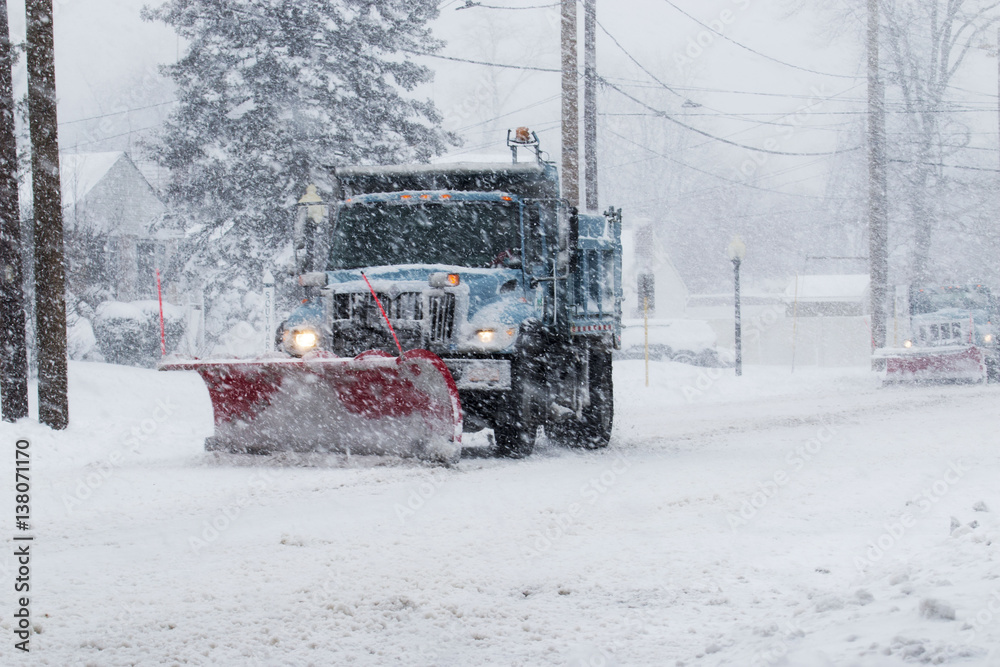 Fototapeta premium Snow plow plowing the streets